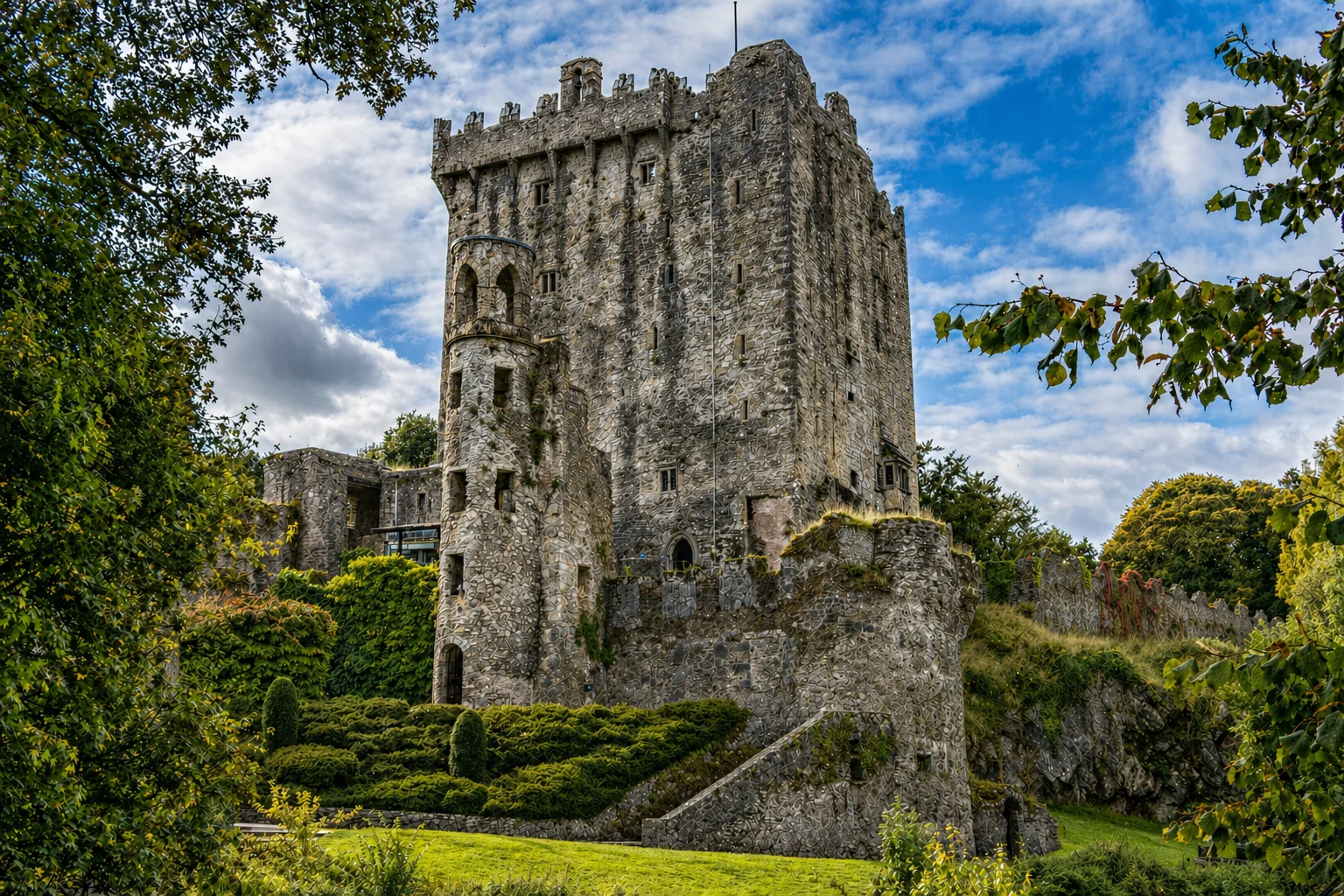 Blarney Castle tower rising above the wooded grounds of County Cork, Ireland