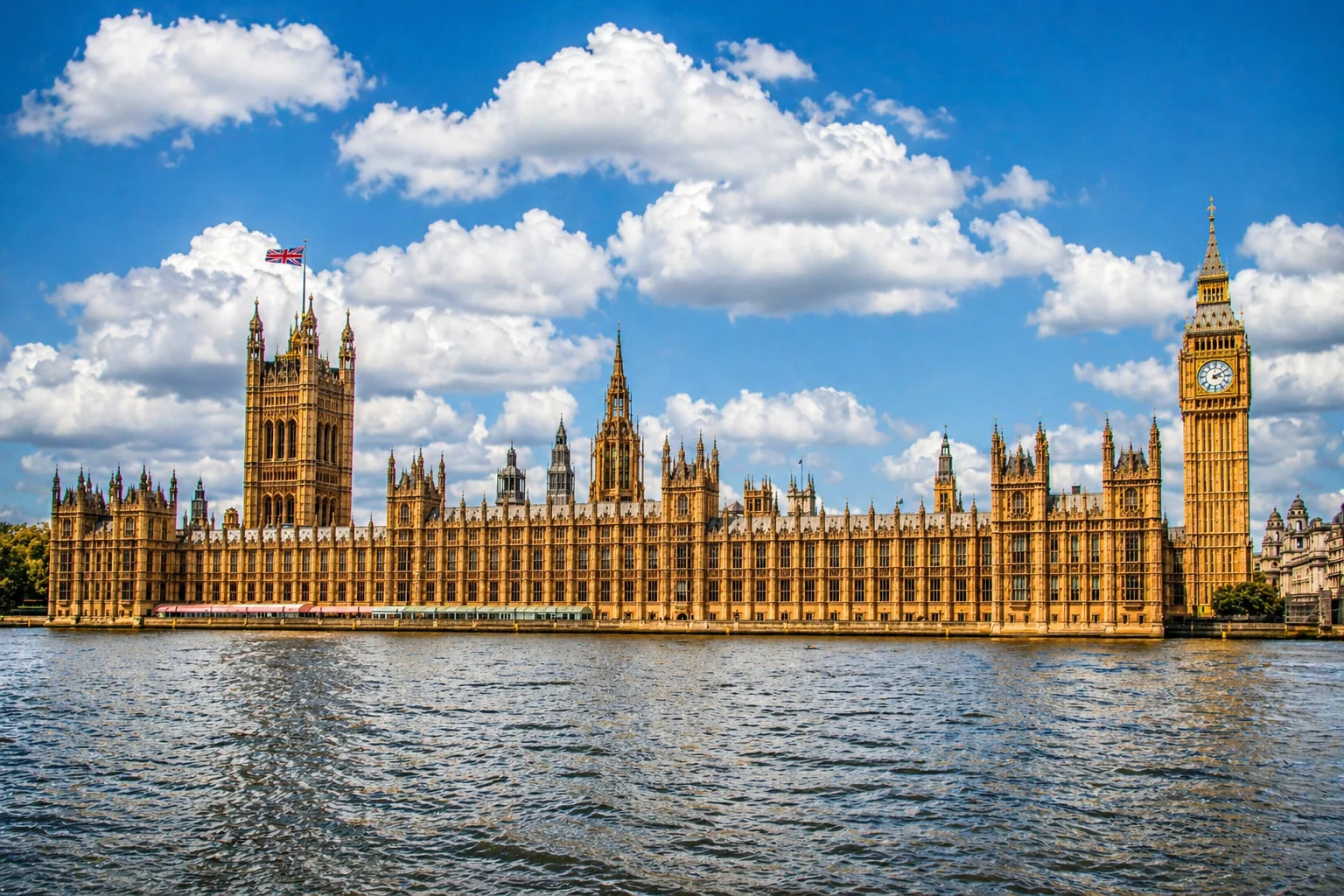 Palace of Westminster and the Elizabeth Tower reflected in the River Thames at dusk